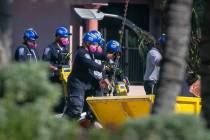Rescue teams use jack hammers to chip through debris and rubble as they continue to look for su ...