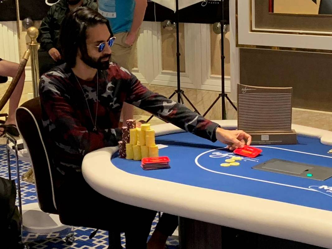 Andrew Moreno plays heads-up with the trophy by his side at the Wynn Millions on Saturday, July ...