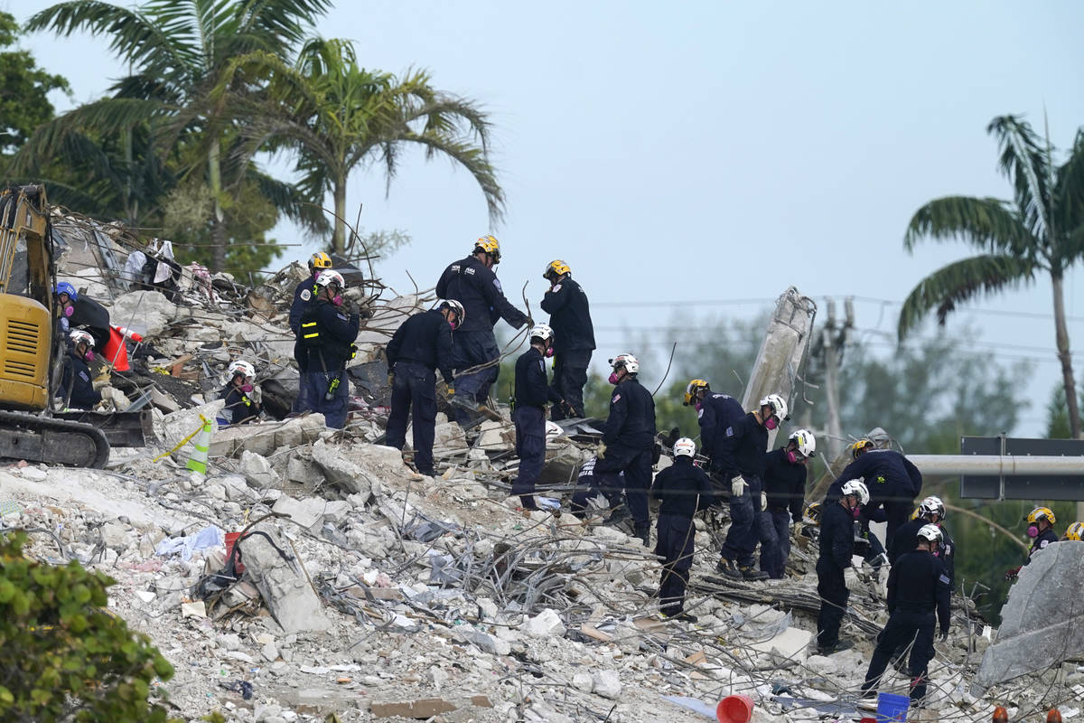 Rescue crews work at the site of the collapsed Champlain Towers South condo building after the ...