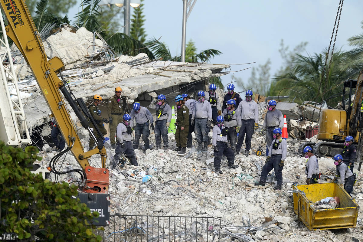 Rescue crews work at the site of the collapsed Champlain Towers South condo building after the ...