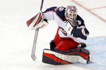 FILE - Columbus Blue Jackets goaltender Matiss Kivlenieks (80) has the puck in his hand as he m ...
