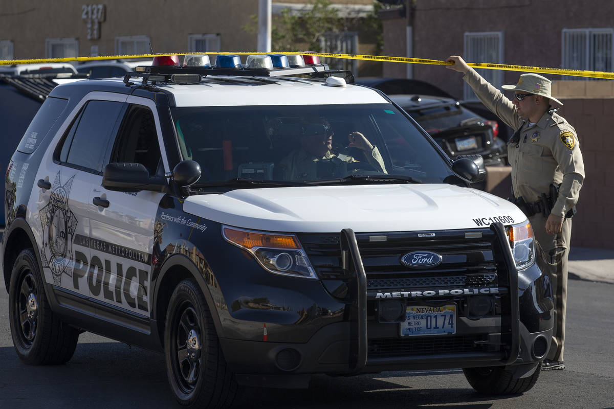 Metropolitan police investigate a homicide in the 6900 block of Mendon Lane in the northeast va ...