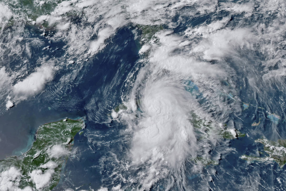 This GOES-16 GeoColor satellite image taken Monday, July 5, 2021, at 4:50 p.m. EDT, and provide ...