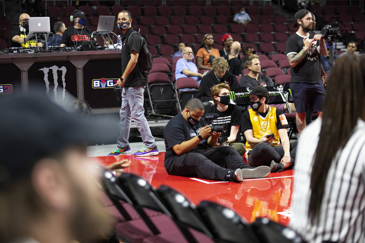 BallDawgs employees Malik Ricks, left, Jacob Machnik and Carter Garife record a BIG3 basketball ...