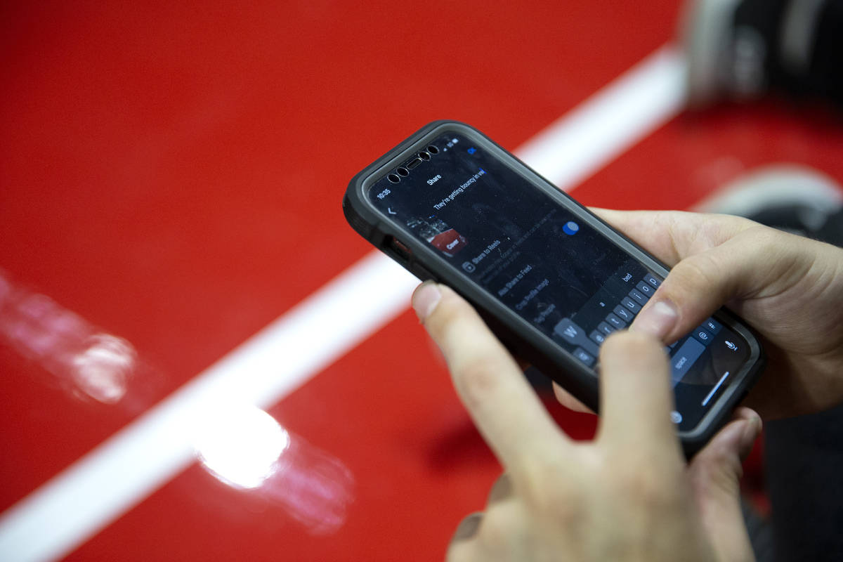 Carter Garife, BallDawgs director of social media, crafts a post during a BIG3 basketball leagu ...