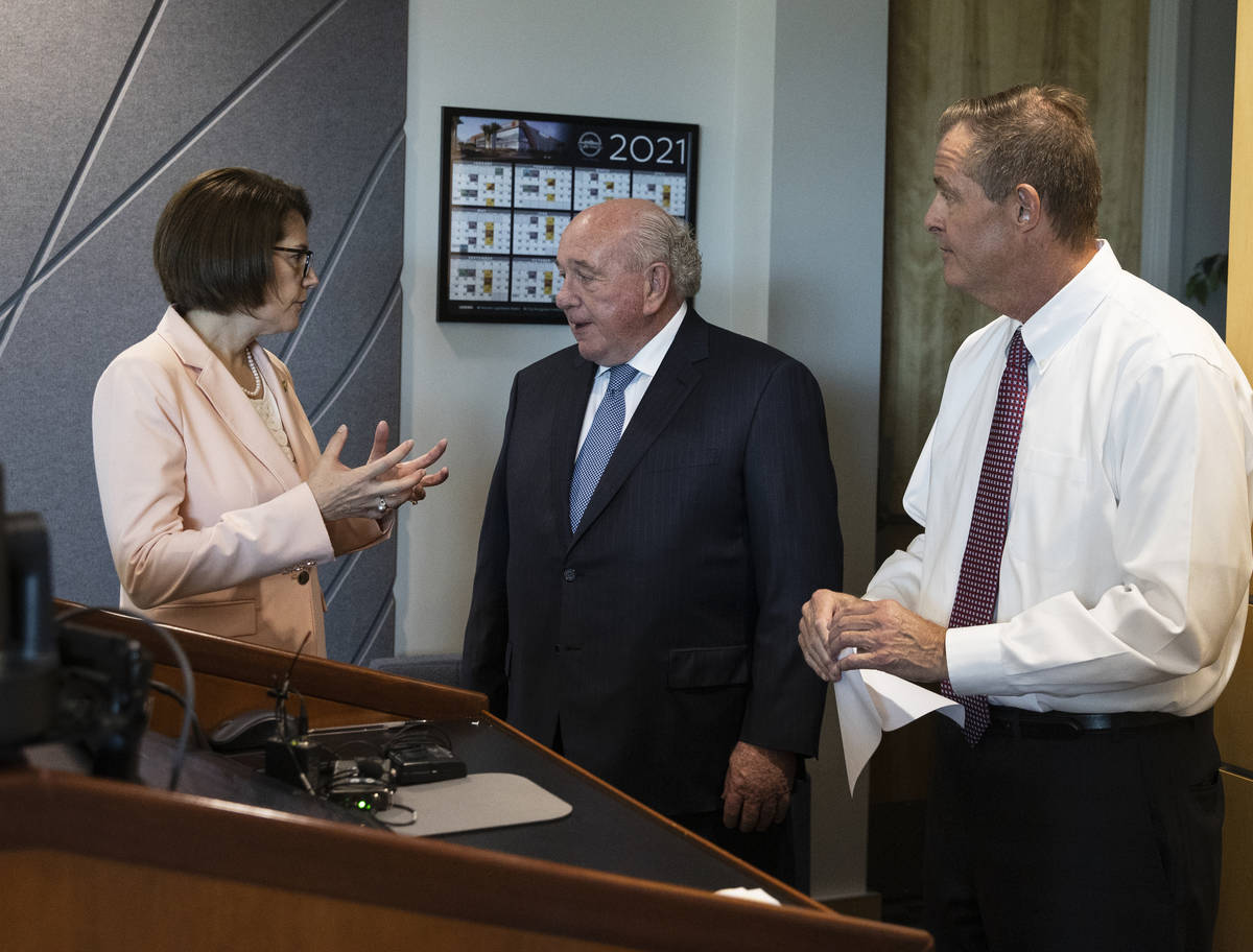 U.S. Sen. Catherine Cortez Masto, D-Nev., talks with Henderson Mayor Pro Tem Dan Shaw, center, ...