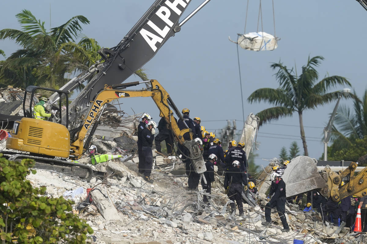 Rescue crews work at the site of the collapsed Champlain Towers South condo building after the ...