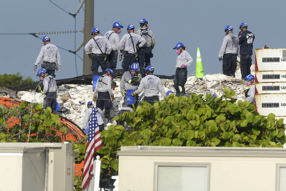 Rescue crews work at the site of the collapsed Champlain Towers South condo building after the ...
