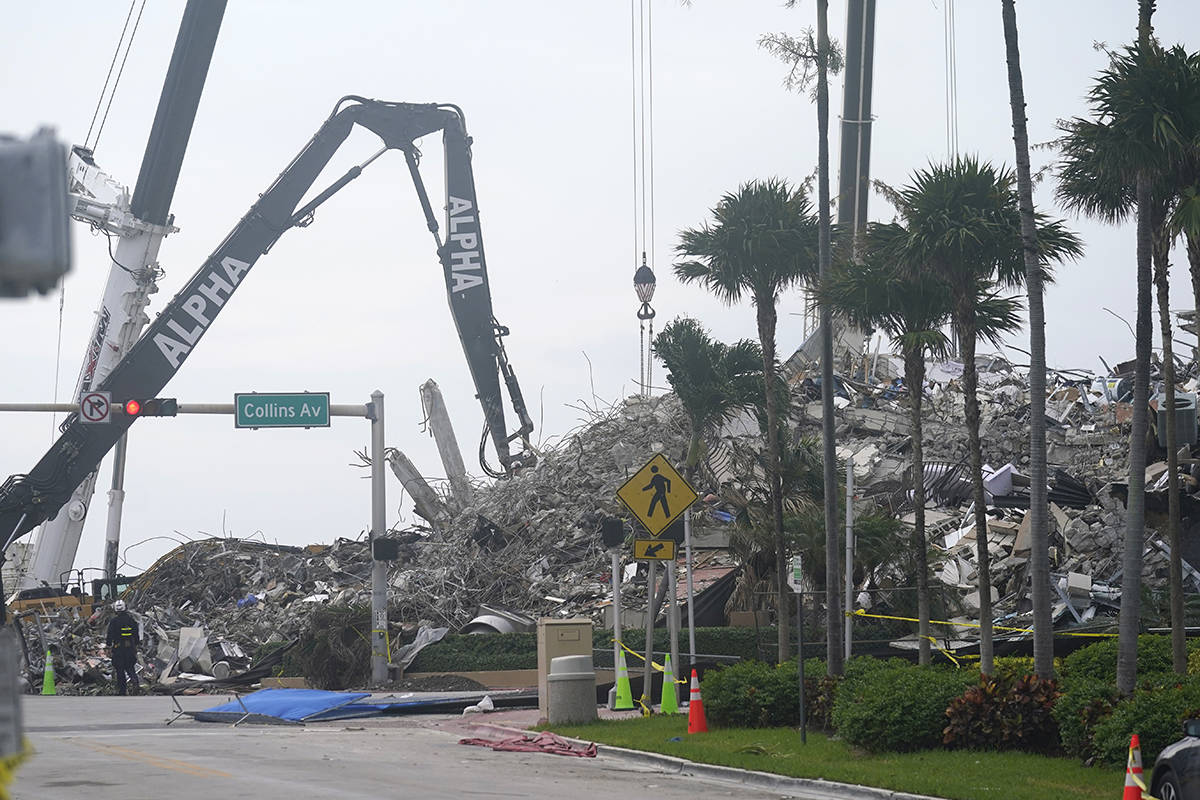 Rescue crews work in the rubble of the collapsed Champlain Towers South condominium building, T ...