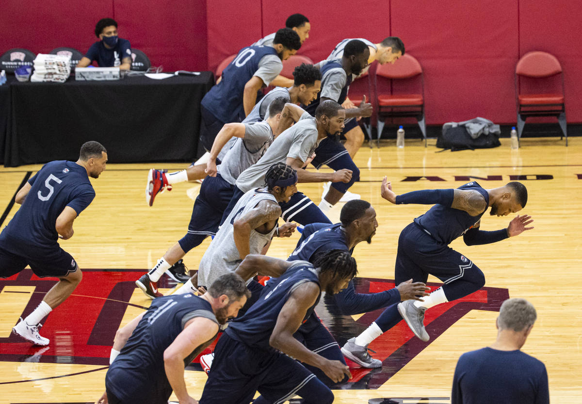 USA Basketball players train during the first day of practice, ahead of the OIympics, at Menden ...