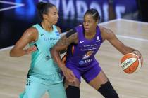 Phoenix Mercury's Kia Vaughn, right, is defended by New York Liberty's Kiah Stokes during the f ...