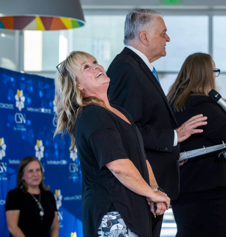 Teacher Elizabeth Allder is surprised after winning $250,000 as Governor Steve Sisolak and Immu ...