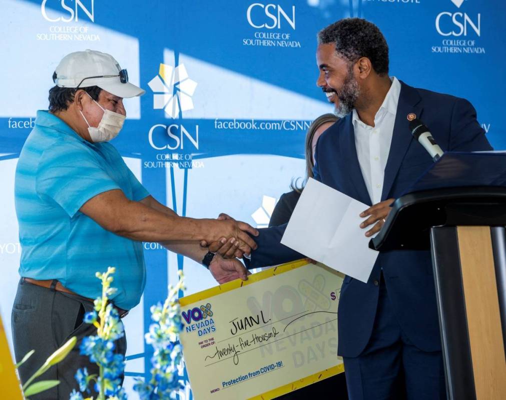 Juan Lemus is congratulated by Congressman Steven Horsford after winning $25,000 as Governor St ...
