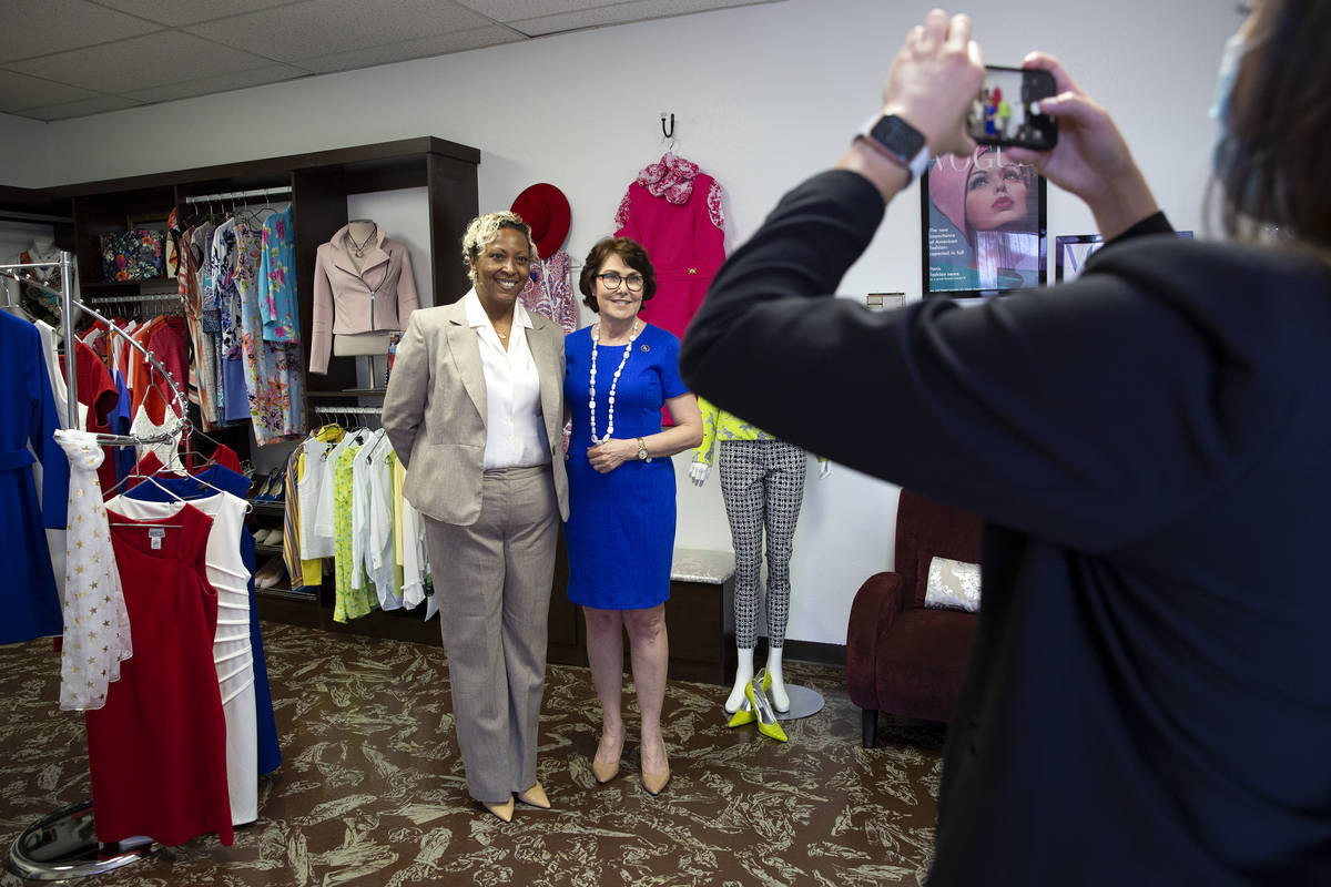 Kenya Mills and Sen. Jacky Rosen, D-Nev., pose for a photo at nonprofit Dress for Success South ...