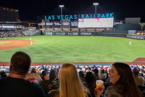 Jamie Lewis, right, laughs with her friend Nettie Byerly, center, during a Las Vegas Aviators g ...