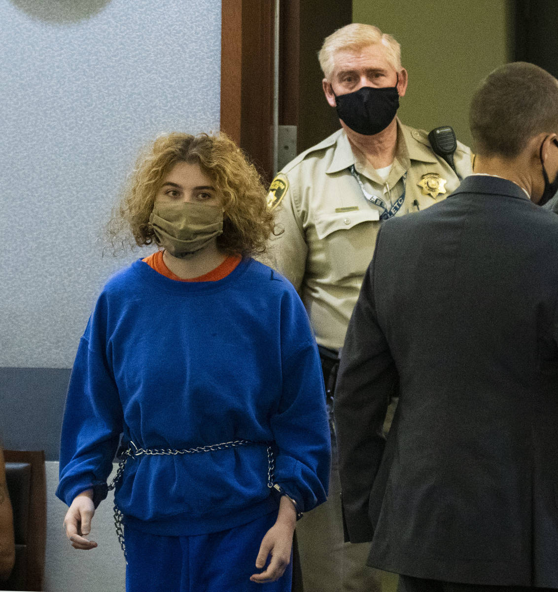 Sierra Halseth, charged in the killing of her father, Daniel Halseth, is led into the courtroom ...