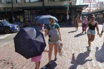 Sabina Ehmann and her daughter Vivian, visiting Seattle from North Carolina, are prepared with ...