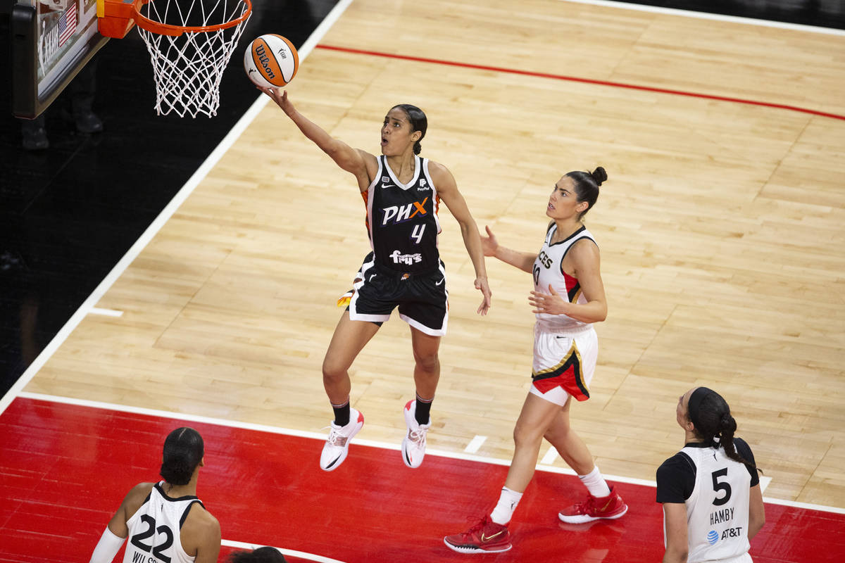 Phoenix Mercury guard Skylar Diggins-Smith (4) shoots a point while Las Vegas Aces guard Kelsey ...