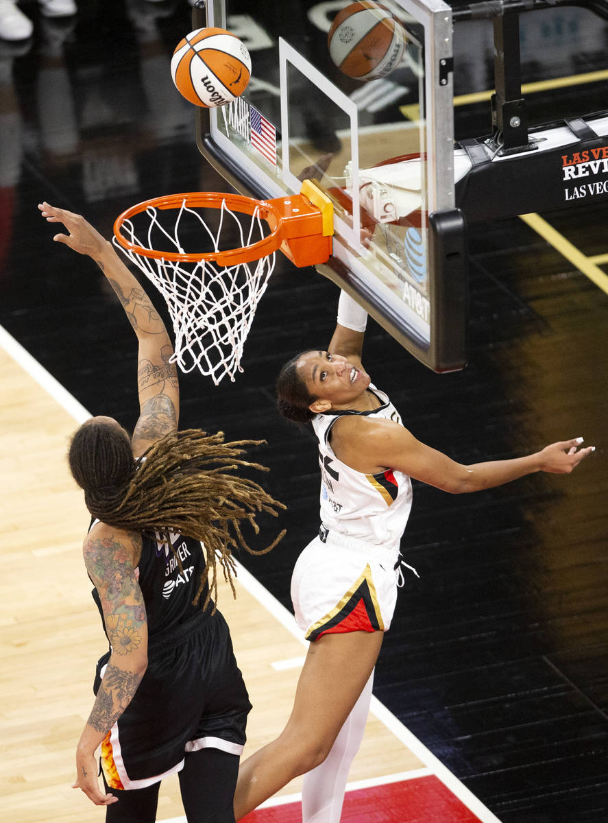 Las Vegas Aces forward A'ja Wilson (22) shoots a point while Phoenix Mercury center Brittney Gr ...
