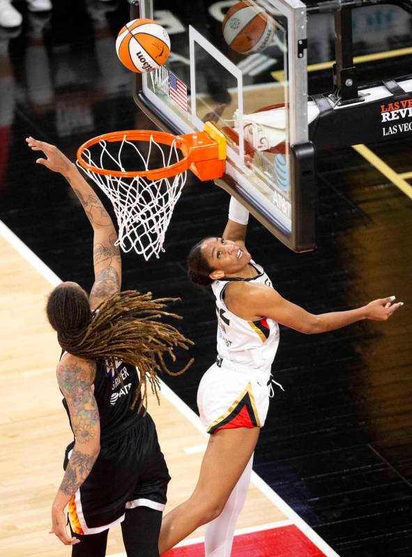 Las Vegas Aces forward A'ja Wilson (22) shoots a point while Phoenix Mercury center Brittney Gr ...