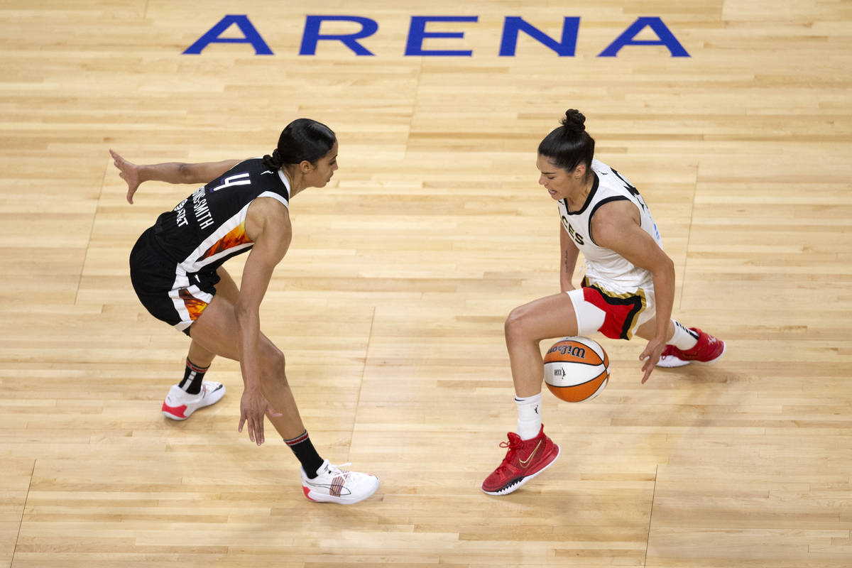 Phoenix Mercury guard Skylar Diggins-Smith (4) guards Las Vegas Aces guard Kelsey Plum (10) as ...