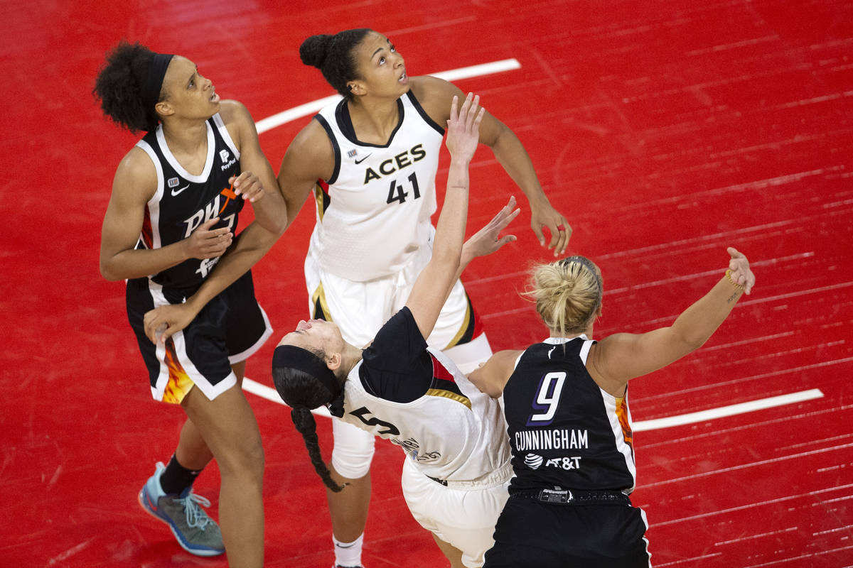 Phoenix Mercury guard Sophie Cunningham (9) fouls Las Vegas Aces forward Dearica Hamby (5) whil ...