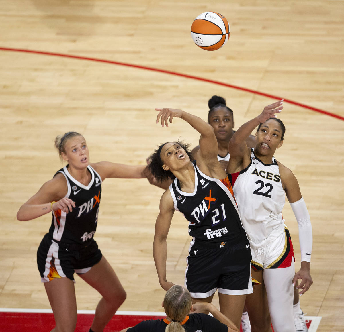 Las Vegas Aces forward A'ja Wilson (22) and Phoenix Mercury forward Brianna Turner (21) tip off ...