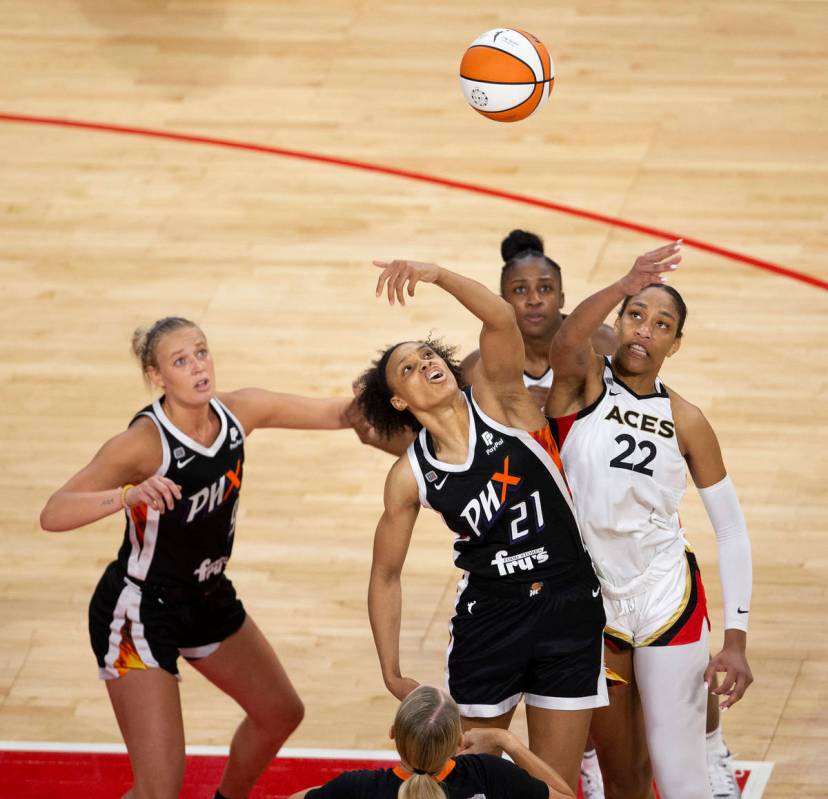 Las Vegas Aces forward A'ja Wilson (22) and Phoenix Mercury forward Brianna Turner (21) tip off ...
