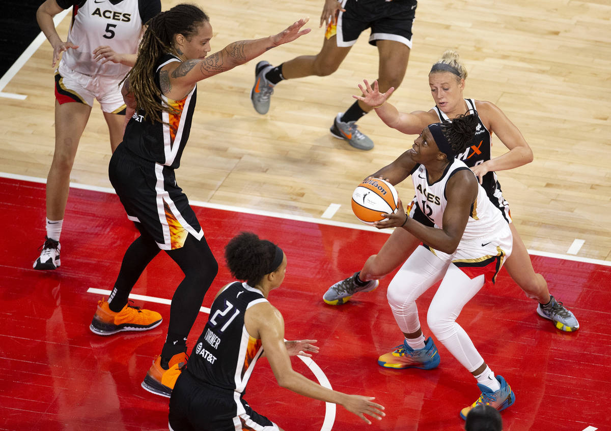 Las Vegas Aces guard Chelsea Gray (12) is guarded by Phoenix Mercury center Brittney Griner (42 ...