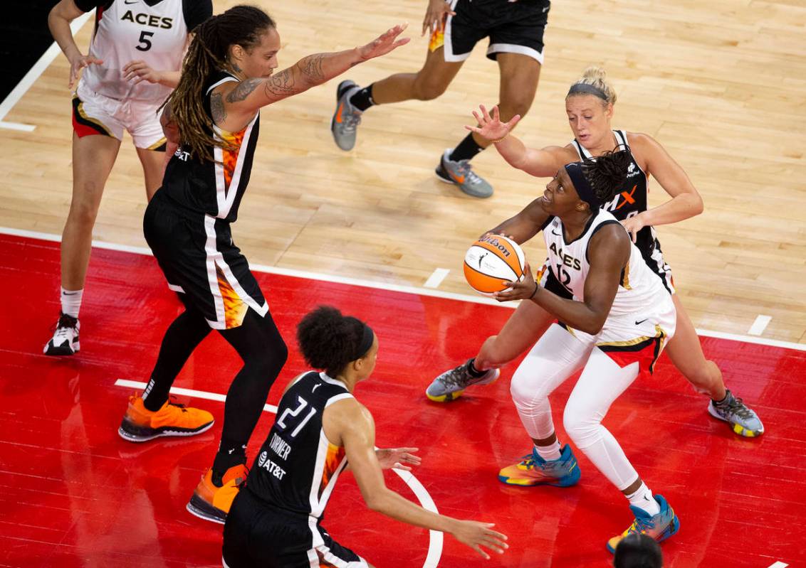 Las Vegas Aces guard Chelsea Gray (12) is guarded by Phoenix Mercury center Brittney Griner (42 ...