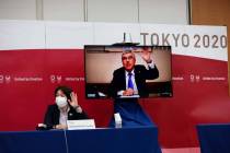 International Olympic Committee (IOC) president Thomas Bach (on-screen) and Tokyo 2020 presiden ...