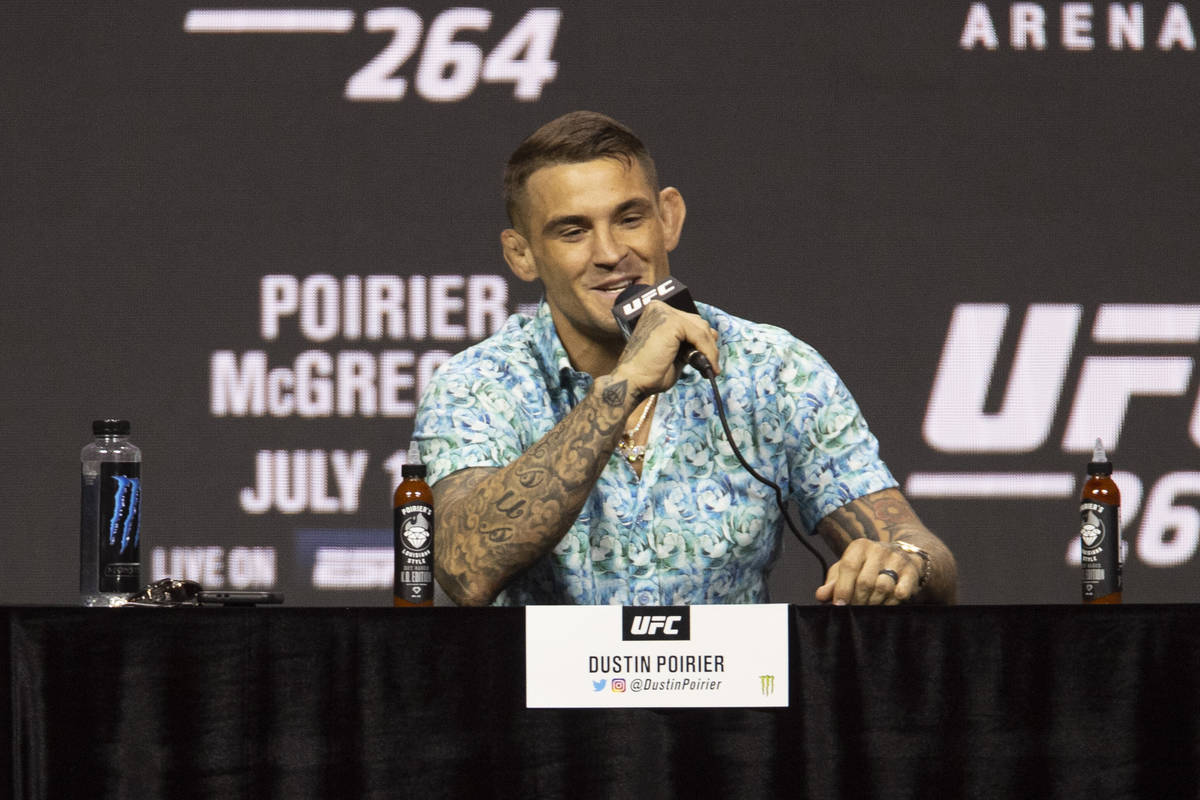 Dustin Poirier speaks during an UFC 264 press conference with Conor McGregor, right, and UFC pr ...