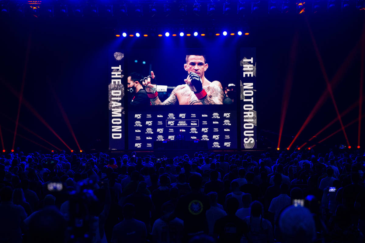 People attend the UFC 264 press conference at T-Mobile Arena in Las Vegas, Thursday, July 8, 20 ...