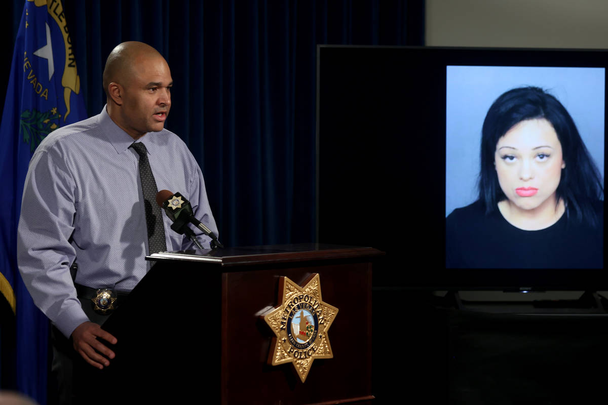 Las Vegas police homicide Lt. Ray Spencer shows a photo during a news conference at Metropolita ...