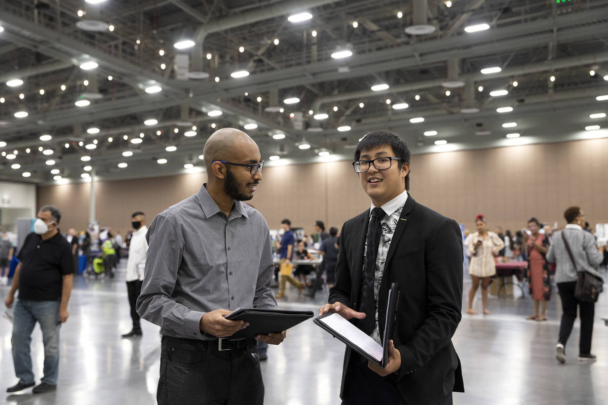 Bruk Adane, left, and Hieu Le, attend a summer job fair put on by Clark County at Las Vegas Con ...