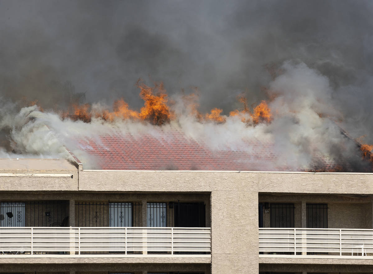 Flames reached up to the roof of Bonanza Park Studios as Las Vegas firefighters battle a fire o ...