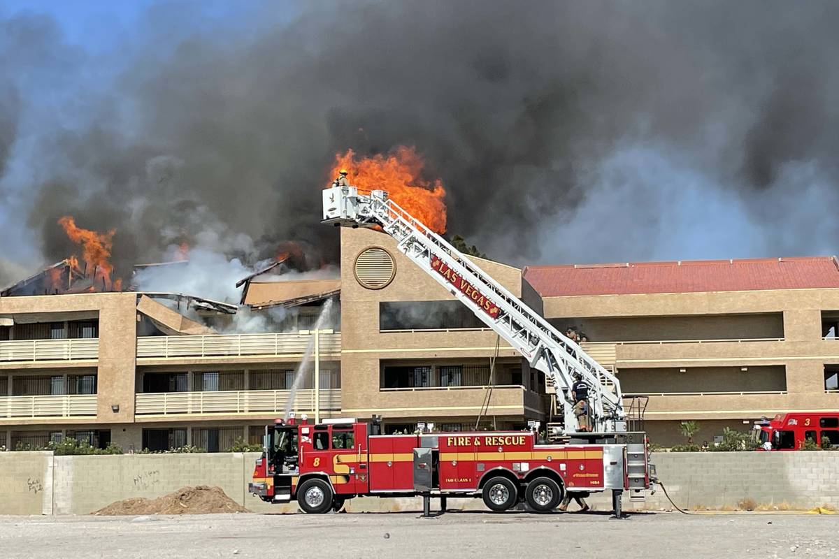 Las Vegas firefighters respond to an apartment complex fire in the central Las Vegas Valley on ...