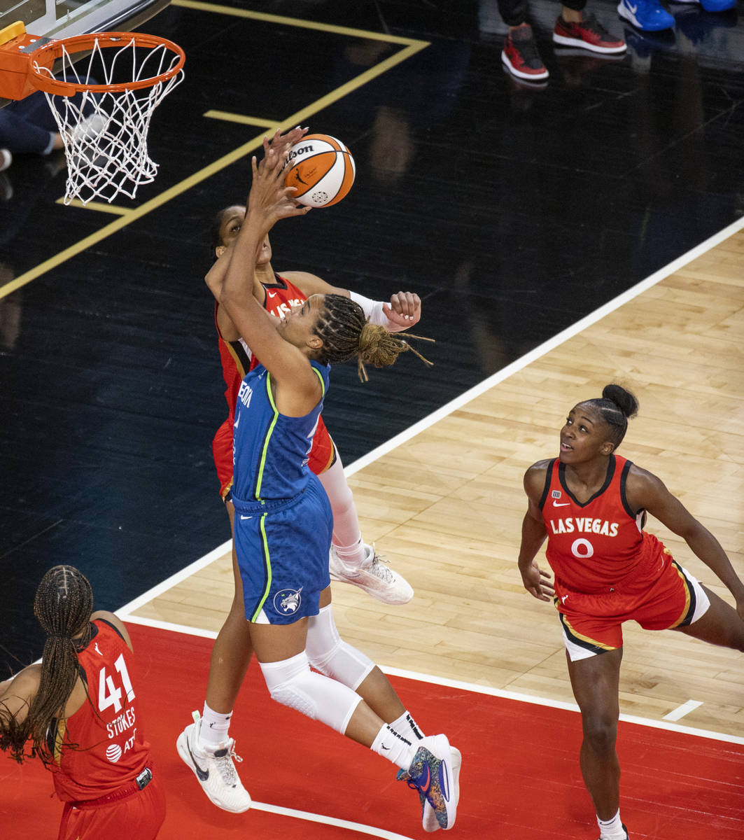 Las Vegas Aces forward A'ja Wilson (22) rejects a shot by Minnesota Lynx forward Napheesa Colli ...
