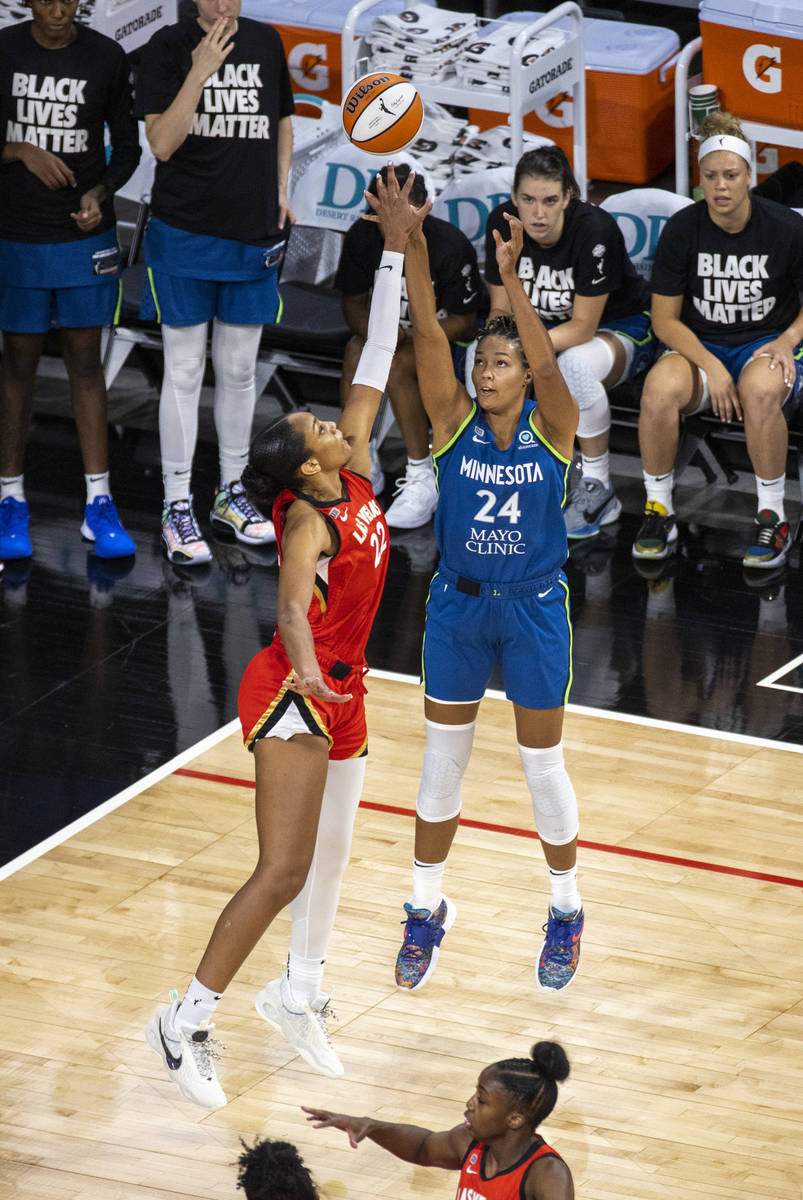 Las Vegas Aces forward A'ja Wilson (22) rejects a shot by Minnesota Lynx forward Napheesa Colli ...