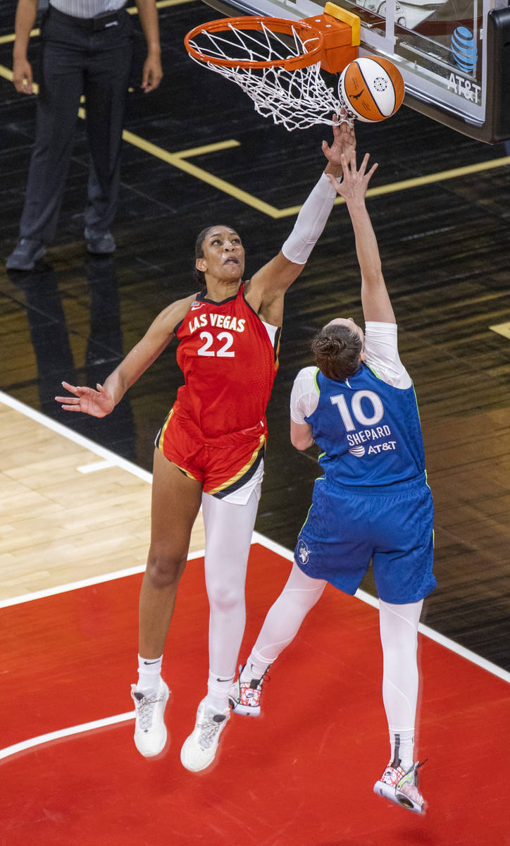 Las Vegas Aces forward A'ja Wilson (22) slaps away a shot attempt by Minnesota Lynx forward Jes ...