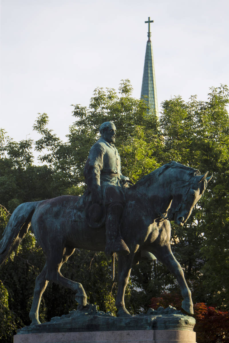 Workers prepare to remove the monument of Confederate General Robert E. Lee on Saturday, July 1 ...