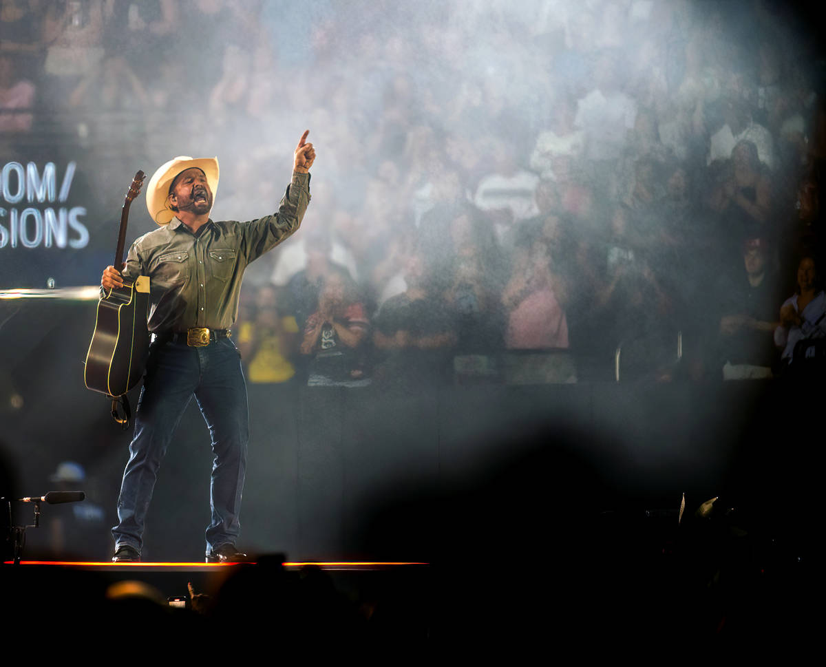 Garth Brooks performs before the crowd at Allegiant Stadium on Friday, July 10 2021, in Las Veg ...