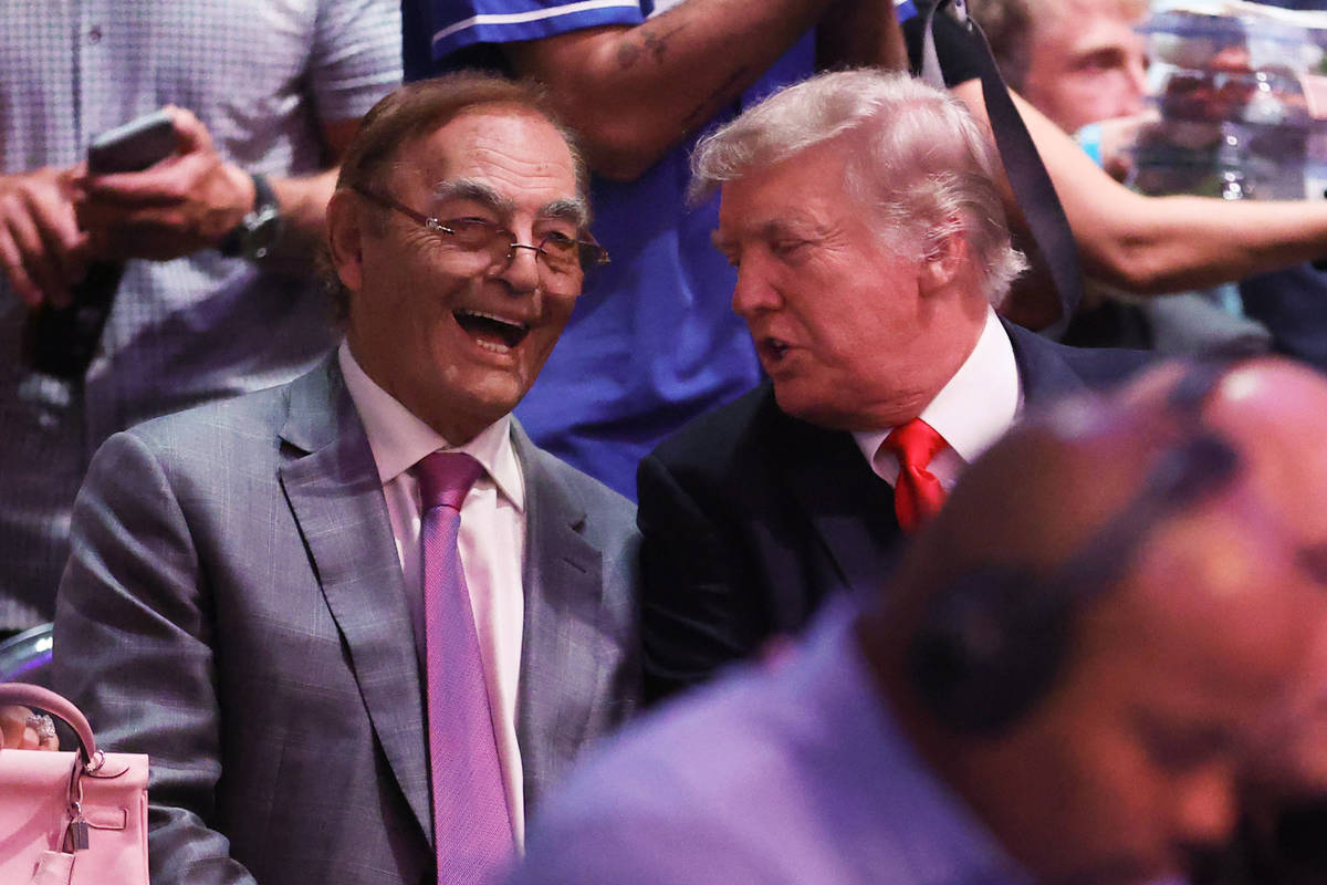 Phil Ruffin, owner of the Treasure Island, and Former President Donald Trump attend UFC 264 at ...