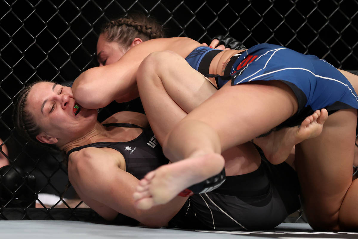 Jennifer Maia, left, battles Jessica Eye in the first round of a womenÕs flyweight bout ag ...