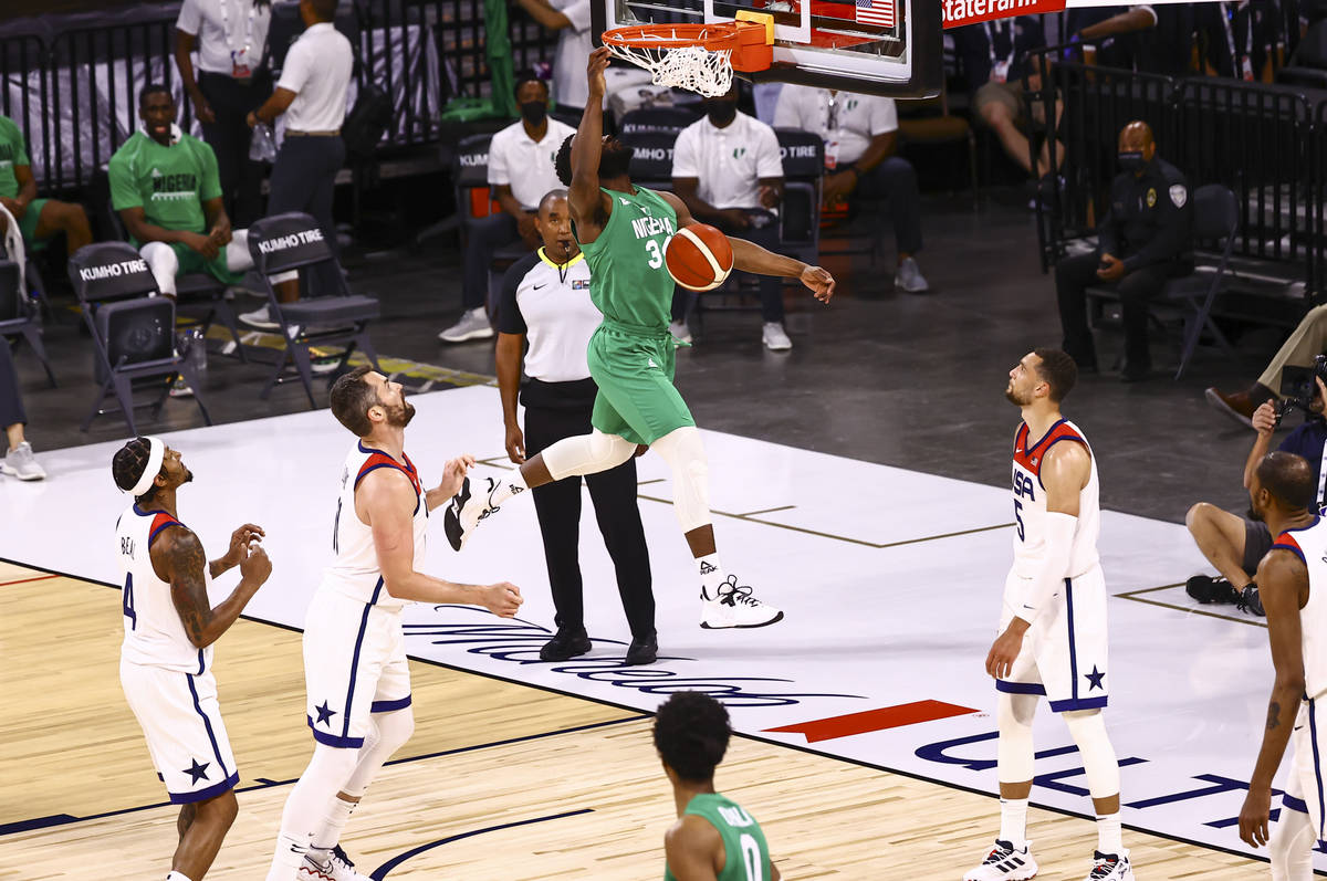 Ike Nwamu (34) dunks against USA during the first half of an exhibition basketball game ahead o ...