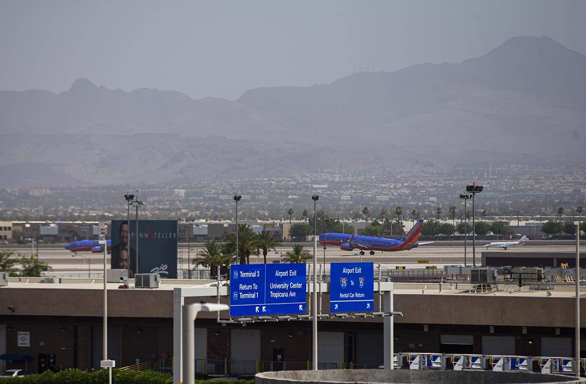 A Southwest Airlines plane takes off from McCarran International Airport as hazy weather condit ...