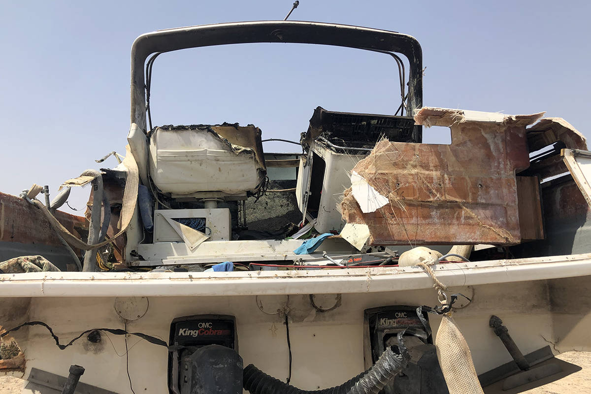 A damaged vessel is seen Sunday, July 11, 2021, outside Las Vegas Boat Harbor at Lake Mead afte ...