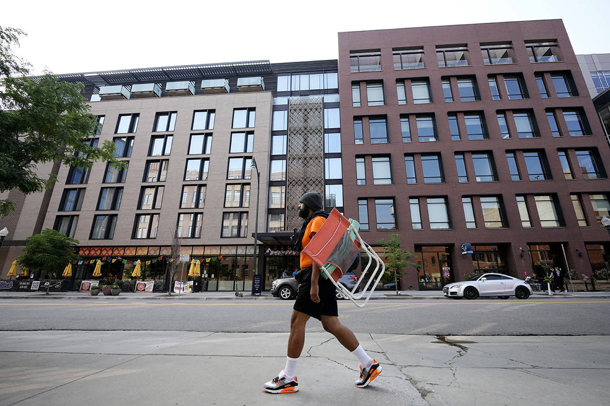 A man walks past the Maven Hotel Sunday, July 11, 2021, in lower downtown Denver. Authorities s ...