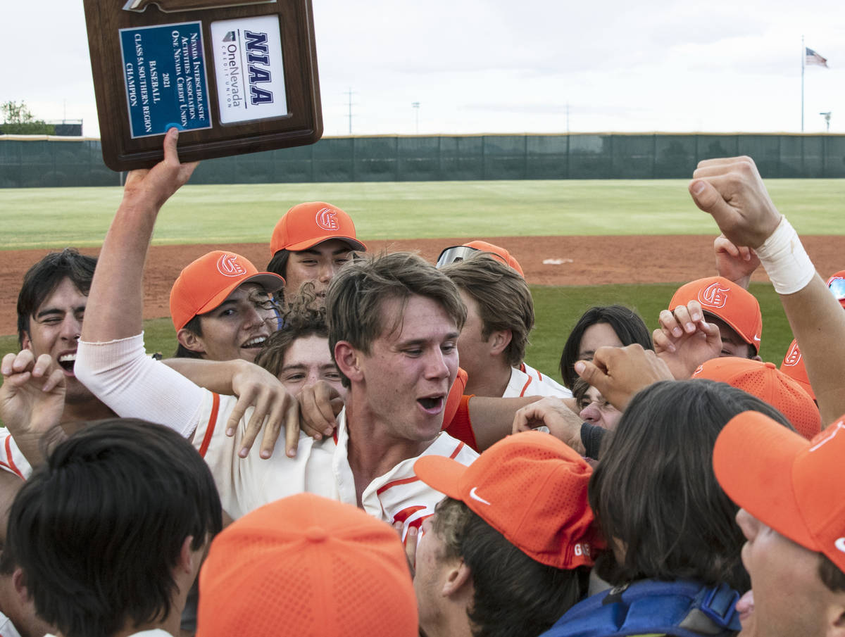 Bishop Gorman HighÕs right fielder Tyler Whitaker joins his teammates as they celebrate th ...