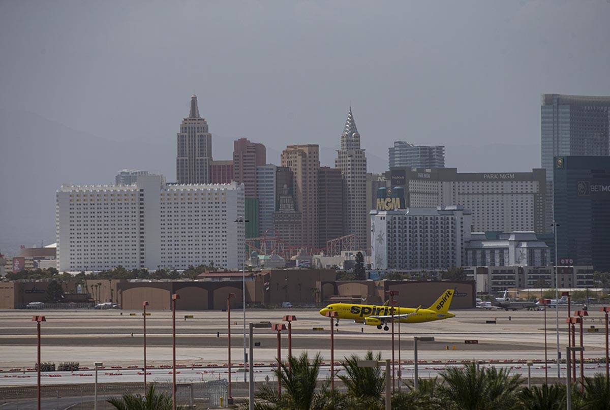 A Spirit Airlines plane lands at McCarran International Airport as hazy weather blankest the La ...